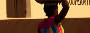 Women carrying a basket on her head.