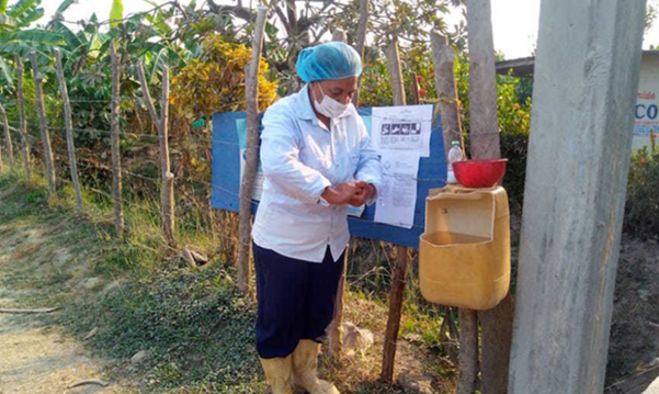 Banana worker washing her hands during the COVID-19 pandemic working at Cooperativa Multiactiva de Bananeros del Magdalena