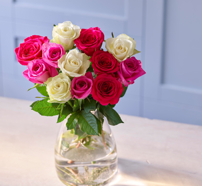Rose bouquet from Co-op against blue wall
