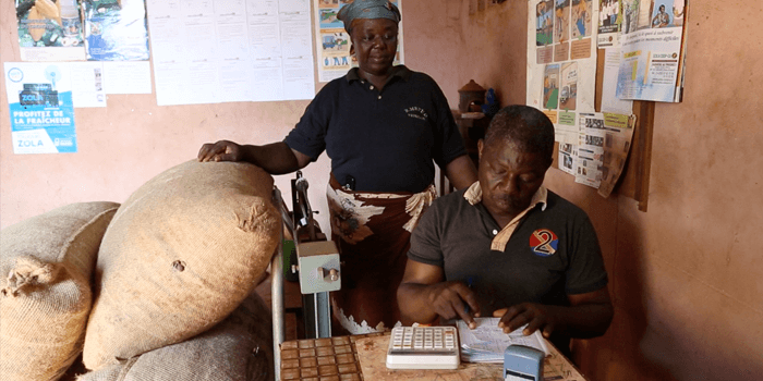 Genevieve Yapipko's cocoa is weighed and her pay is calculated
