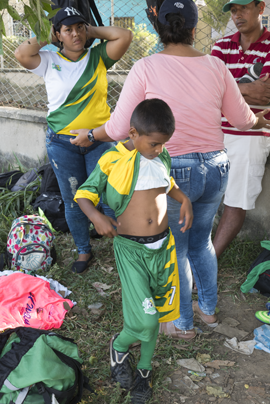 Photo by Ian Berry - boy wearing football kit in Zona Bananera, Colombia