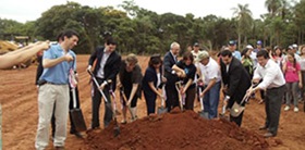 A group of people dig in Manduvira Cooperative in Paraguay