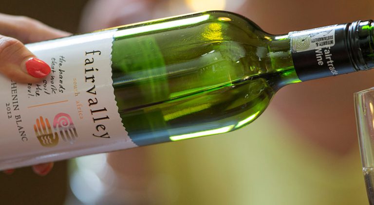 Pouring Fairtrade white wine into a glass