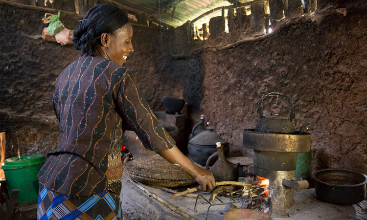 Mulane Jabessa, OCFCU, using her cookstove