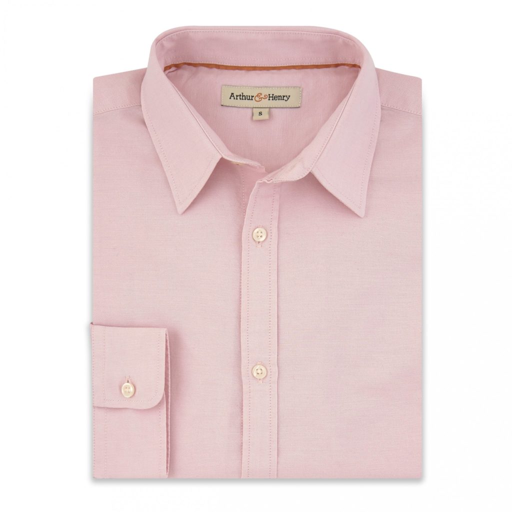 A folded pink Fairtrade cotton shirt