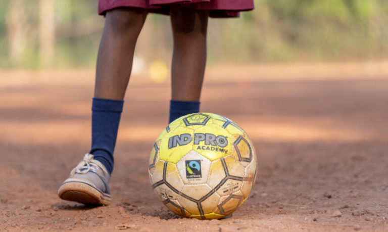 Child about to kick a football