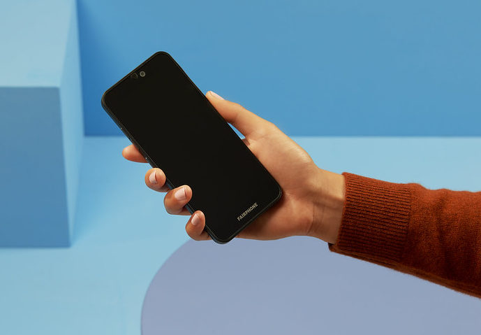 A hand holding the Fairphone 3+