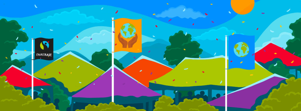 Brightly coloured festival tents among tree tops, with a blue sky. Flags flying above the tents. Flag on the left has the Fairtrade Mark on a black background, middle flag shows a globe held between two hands on orange background, flag on the right shows a globe on a blue background.,