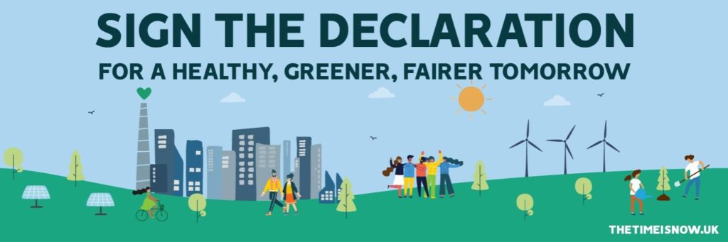 Graphic of a clean energy scene, with windmills, against a blue sky, green grass, trees, solar panels and people walking and riding bikes in front of a small cluster of grey tower blocks. Text reads 'sign the declaraton for a healthy, greener, fairer tomorrow,' linking to the Climate Coalition's Climate Declaration.