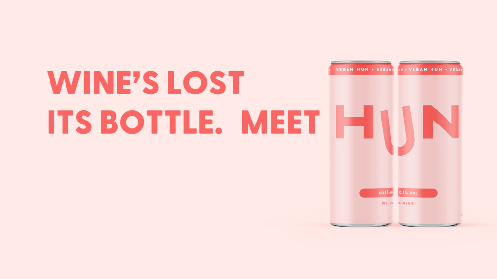 Wine's lost its bottle. Meet HUN. Light Pink background, Pink text, two cans of Hun wine