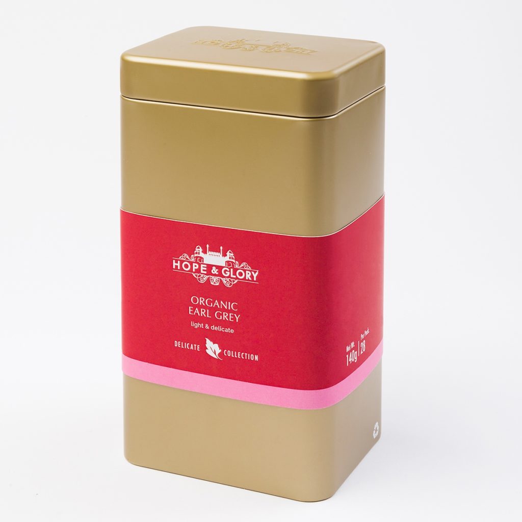 Hope & Glory Earl Grey tea tin - gold tin with red and pink label. 