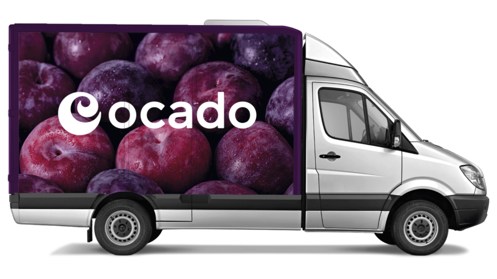 Van with Ocado logo overlaid on an image of plums