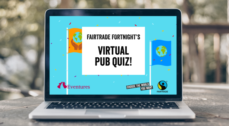 An open laptop with words on screen saying, 'virtual pub quiz'