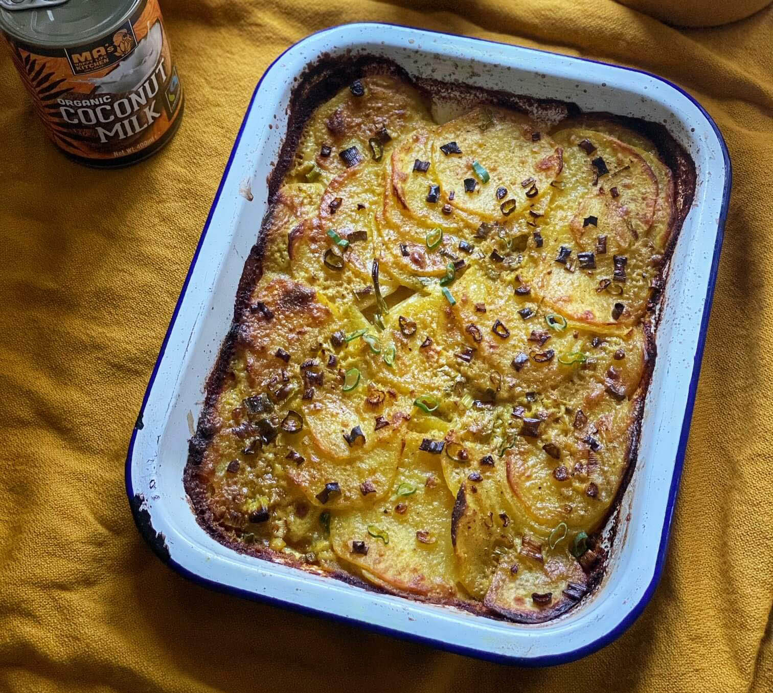 You are currently viewing Rosie Birkett’s Fairtrade coconut milk and turmeric potato gratin