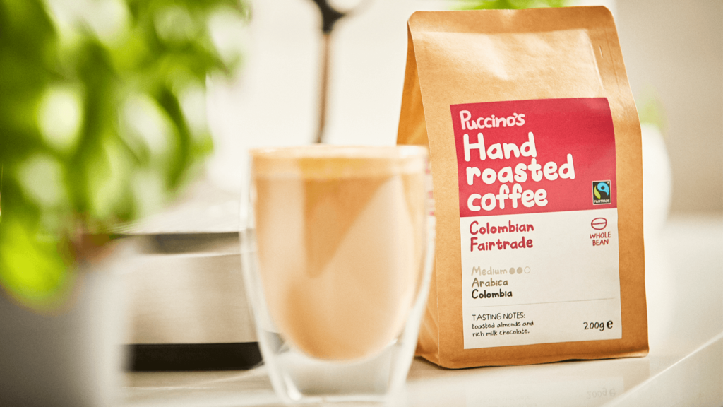 Puccino's hand roasted coffee - Colombian Fairtrade with a glass full of coffee