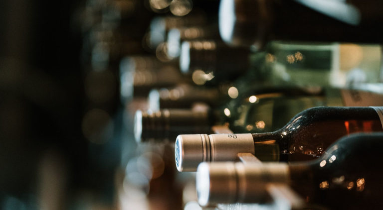 Wine bottles lying in a rack