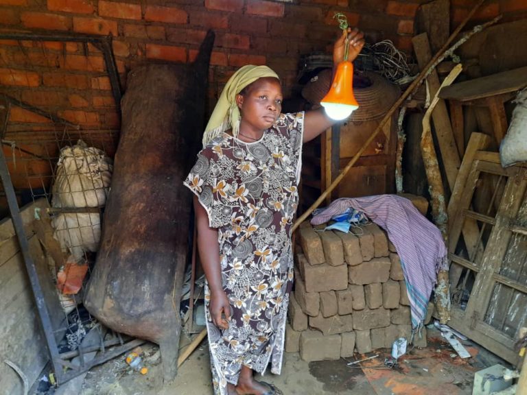 Woman with solar lamp