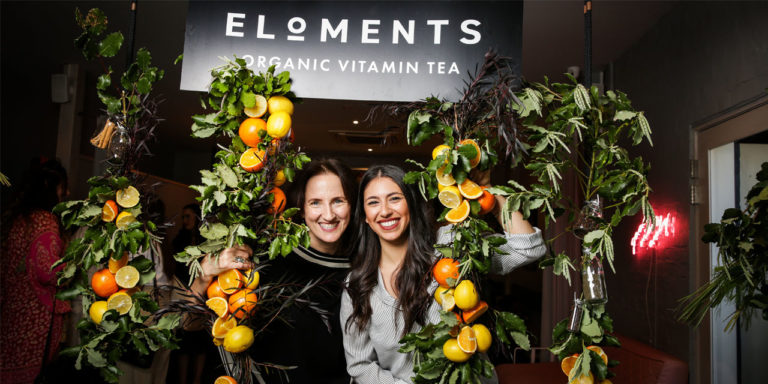 Julie and Nicole under Eloments sign