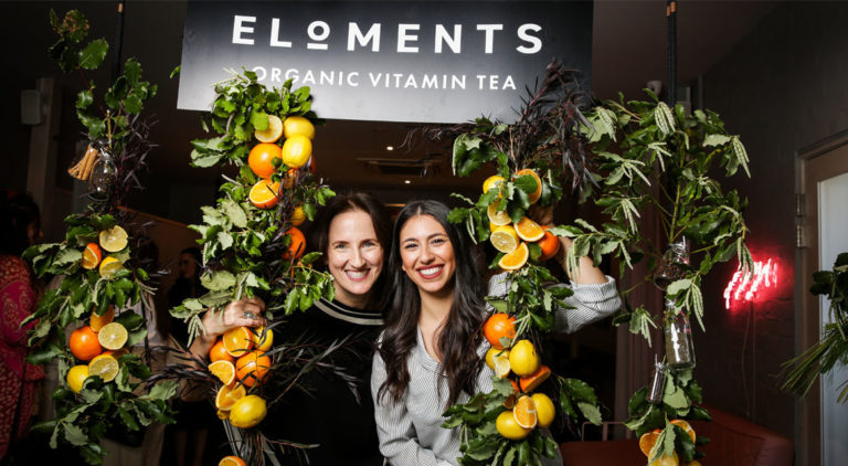 Julie and Nicole under Eloments sign