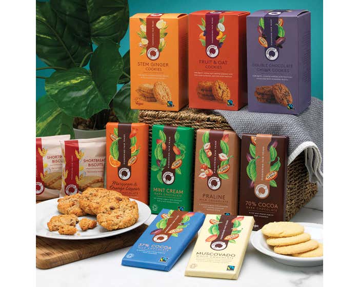 Traidcraft christmas hamper with a variety of chocolate and cookies on display