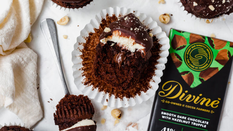 chocolate cup cake with a bar of divine chocolate