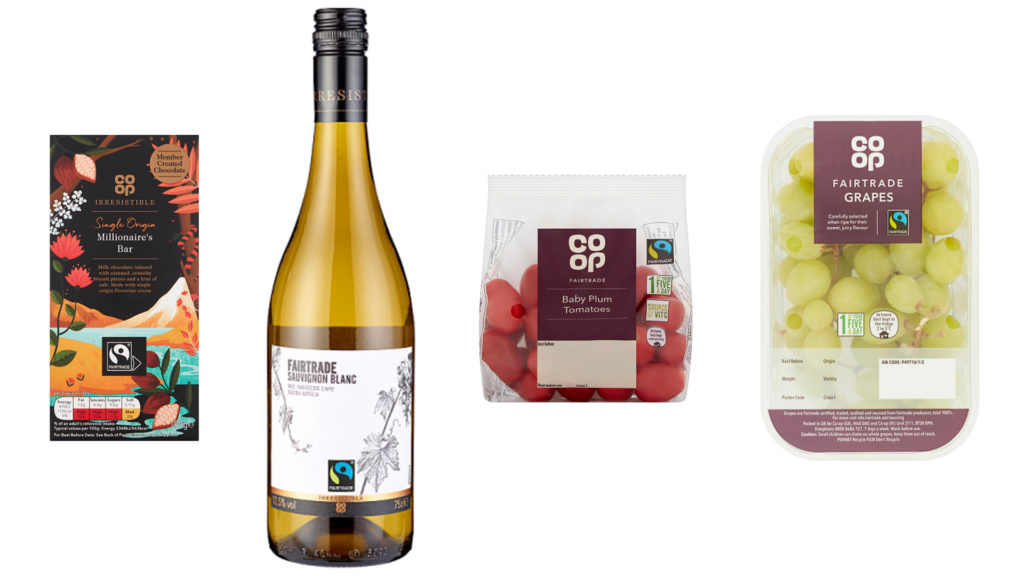 Fairtrade products next to each other: chocolate, bottle of wine, tomatoes and grapes