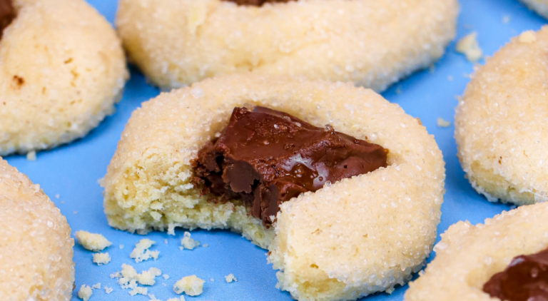 a tray of freshly baked Tony’s Chocolonely thumbprint cookies