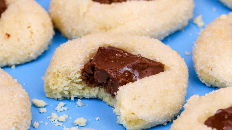 a tray of freshly baked Tony’s Chocolonely thumbprint cookies