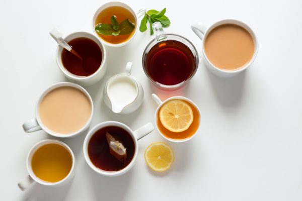 an array of teacups with different varieties of tea