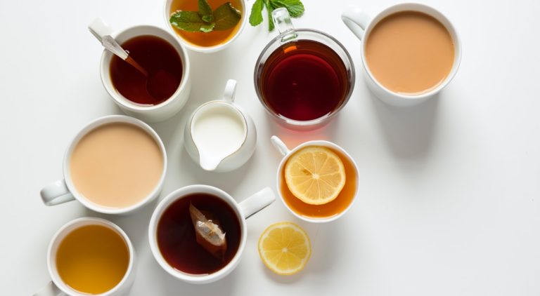 an array of teacups with different varieties of tea
