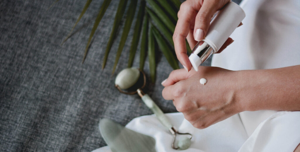 Woman's hands using Fairtrade beauty products