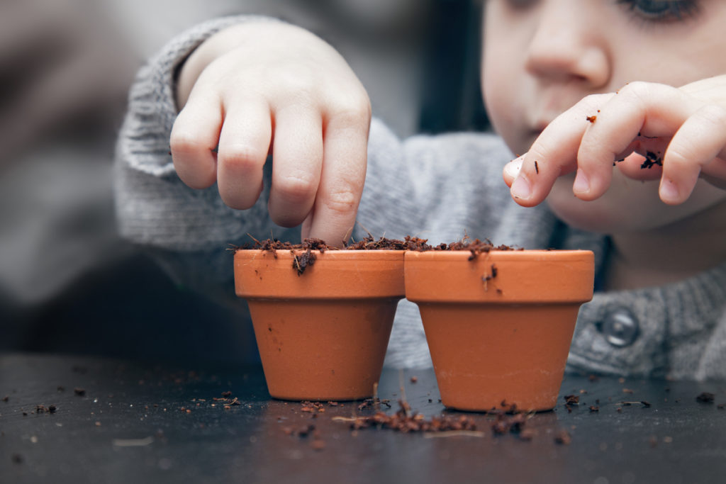 Child planting seeds