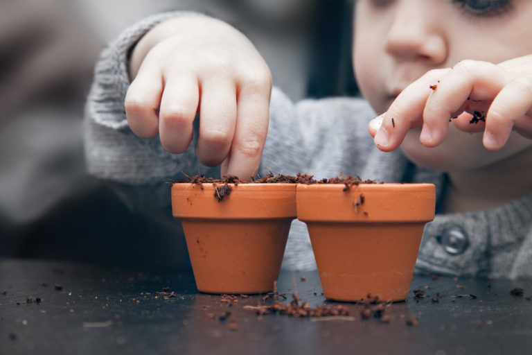 Child planting seeds