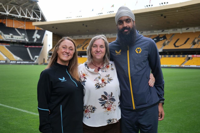 (L-r) Marnie Richards (Wolves Foundation), Julia Farrell, Chair of Wolverhampton City Fairtrade Partnership, Jeevan Kang (Wolves Foundation) at Molineux Stadium. Credit: Wolverhampton City Fairtrade Partnership.